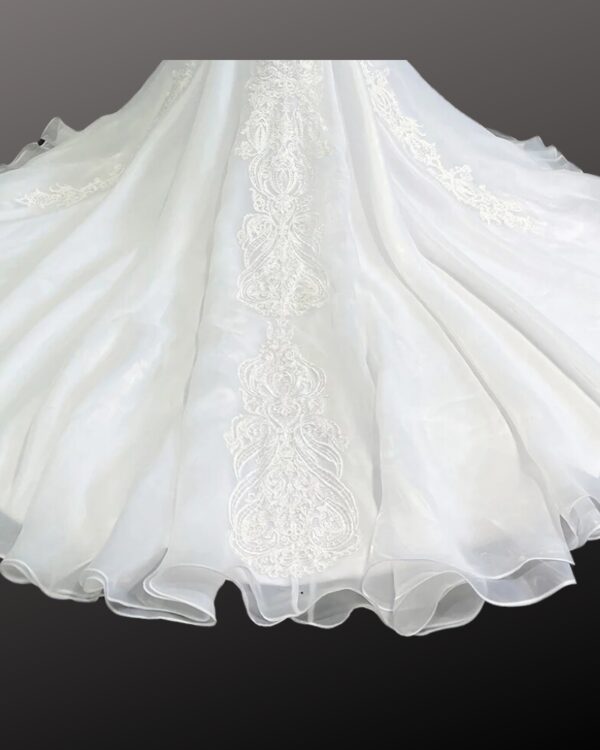 Train of a ivory wedding dress with lace design